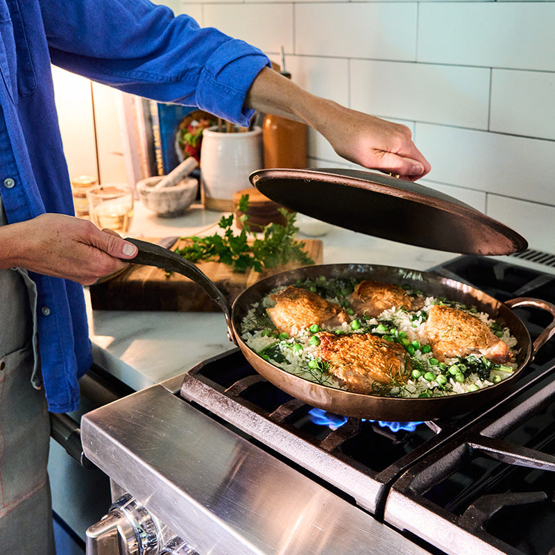 One-Skillet Chicken Thighs and Rice with Fennel, Greens, and Peas 